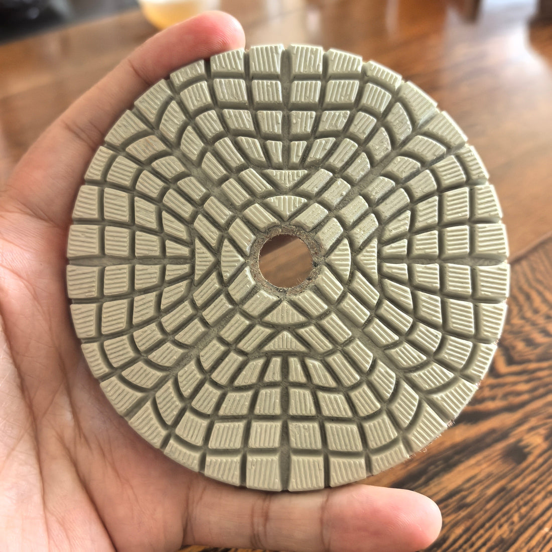 KAIYI diamond polishing pad held in hand showing 5mm working layer thickness – factory direct from Quanzhou China